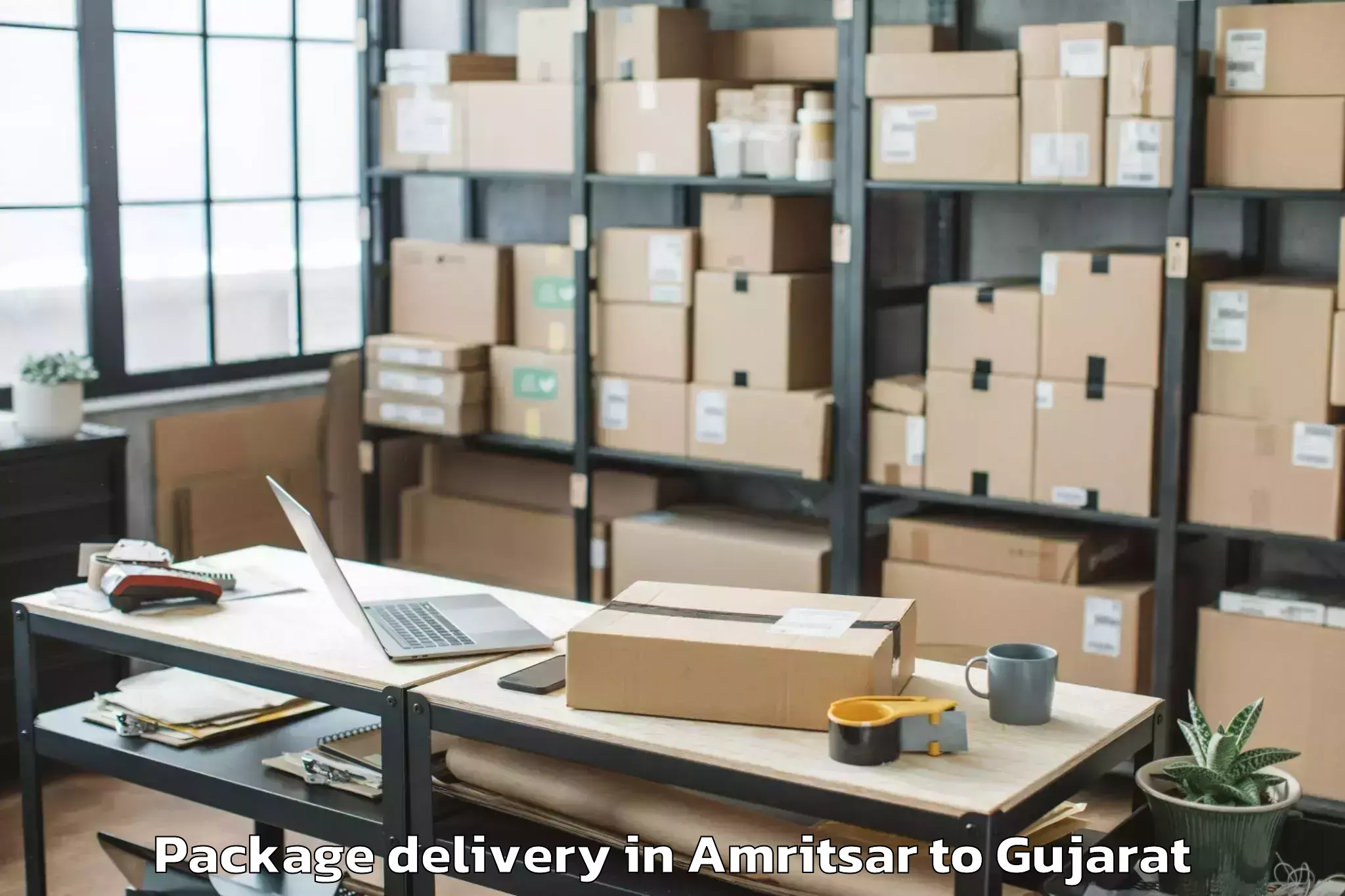 Trusted Amritsar to Khambhaliya Package Delivery